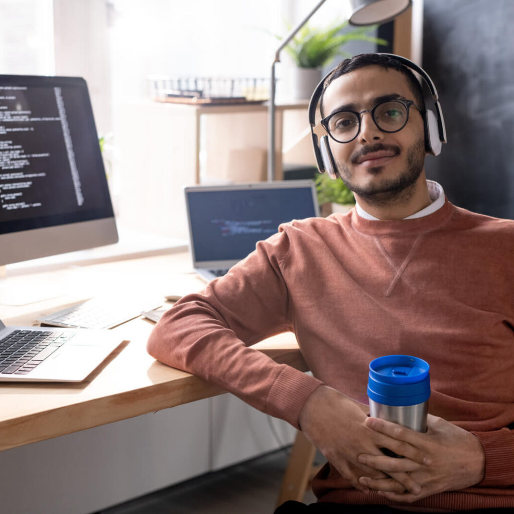 handsome programmer in headphones listening to mus 2023 11 27 04 56 48 utc