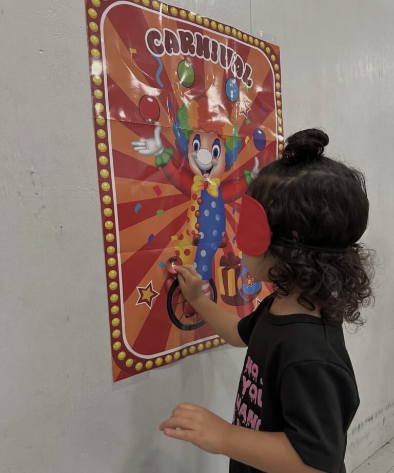 A child taking part in a classroom carnival activity